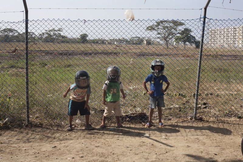 While they are just playing with helmets, the three grandsons of women who were displaced and now live in the community of Refugio La Carolina, will likely grow up to be moto-taxistas like their uncles, brothers, and fathers,who cannot find traditional work. Unemployment is high in Cartagena especially among Afro-descendents, women, indigenous, disenfranchised, and displaced communities, the most vulnerable groups.