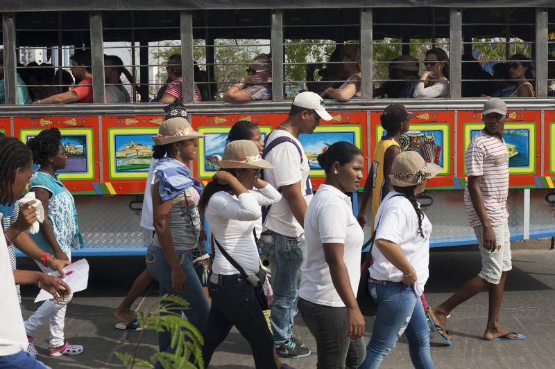 On April 9, 2015, internally displaced victims of the Colombian armed conflict who now live in Cartagena, marched from the famous Castillo San Felipe to the Mayor's office in El Centro in recognition of National Victims Day. The Mayor never exited his office. Here, they walk in front of a 'fun party tour bus' that shows tourists a very limited view of a Cartagena deemed 'tourist friendly' by the travel industry. There is a complete disconnect between tourists and the realities of daily life for many Cartageneros/as.